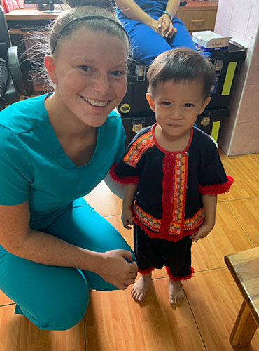 Picture of Our dental staff with a cute boy